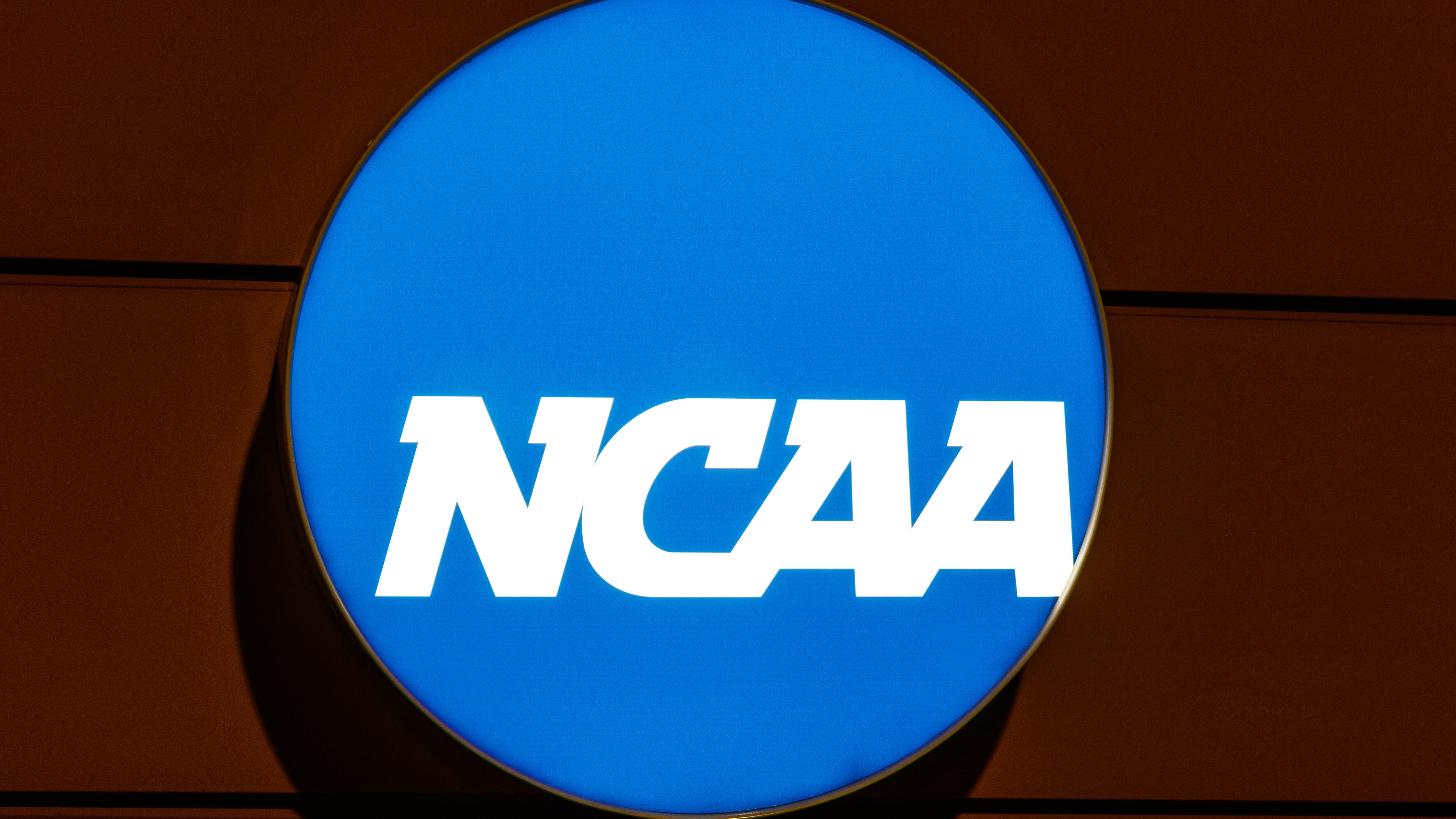 The NCAA along with five conferences voted Thursday to approve a settlement agreement that will allow colleges to pay their athletes directly.