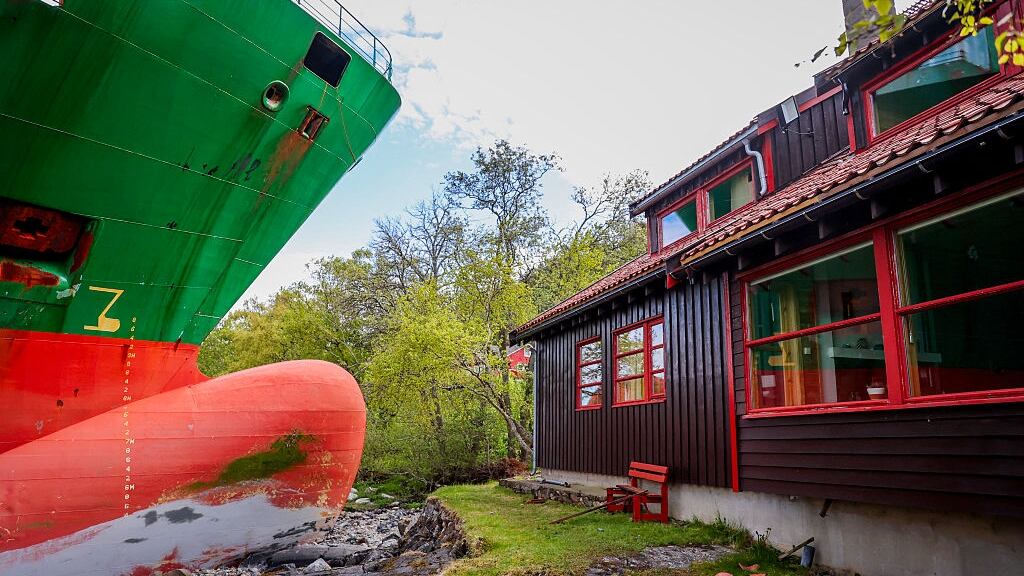 Ship nearly hitting house